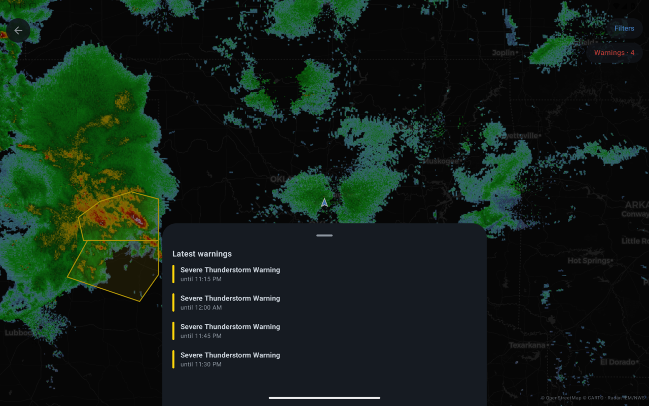 Tablet radar map with a list of the latest severe thunderstorm warnings open over it